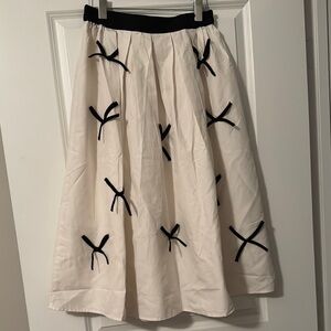 Elegant White Skirt with Black Accent Bows